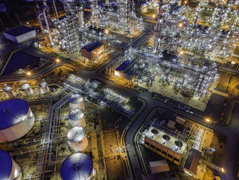 High angle view of illuminated buildings in city at night