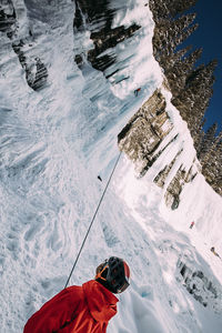 High angle view of man on snowcapped mountain