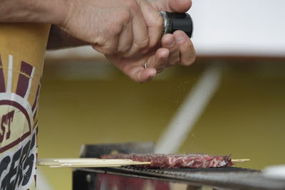 Close-up of person preparing food