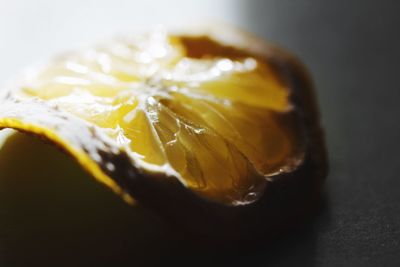 Close-up of lemon slice over black background