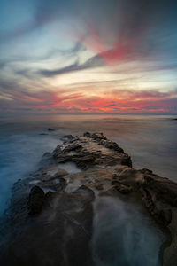 Scenic view of sea against sky during sunset