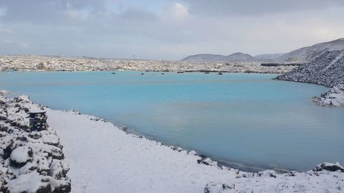 Scenic view of sea against sky during winter