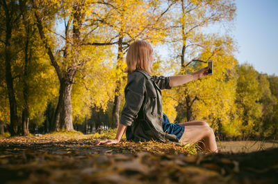 Woman sitting in autumn