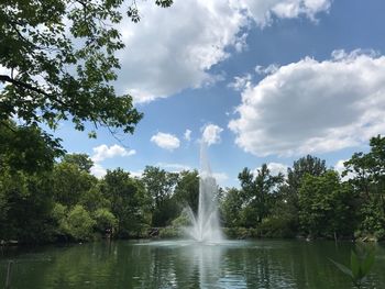 Scenic view of waterfall against sky