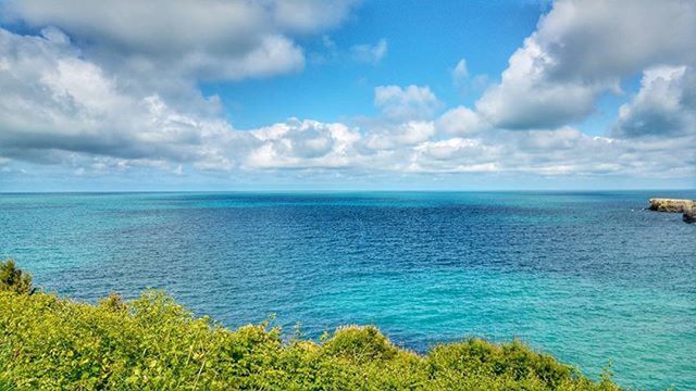 sea, horizon over water, sky, water, tranquil scene, scenics, tranquility, beauty in nature, cloud - sky, nature, cloud, idyllic, cloudy, blue, grass, seascape, coastline, green color, day, beach