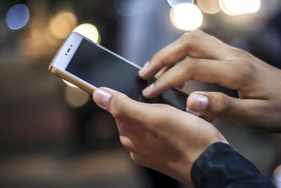 Close-up of man using mobile phone