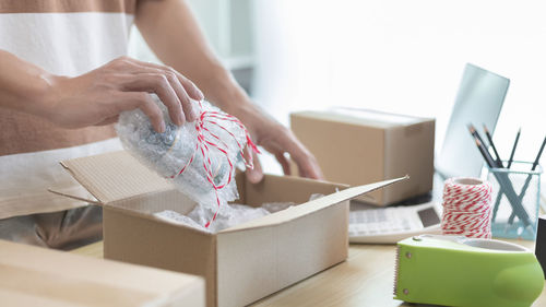 Midsection of woman holding gift box