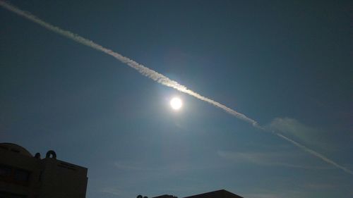 Low angle view of vapor trails in sky