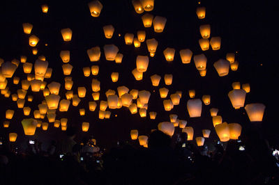 Illuminated lantern at night