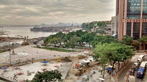 View of harbor against cloudy sky