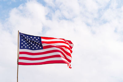 Low angle view of flag against sky