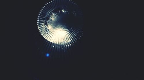 Low angle view of illuminated sky at night