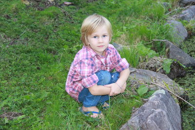 Portrait of smiling boy in grass