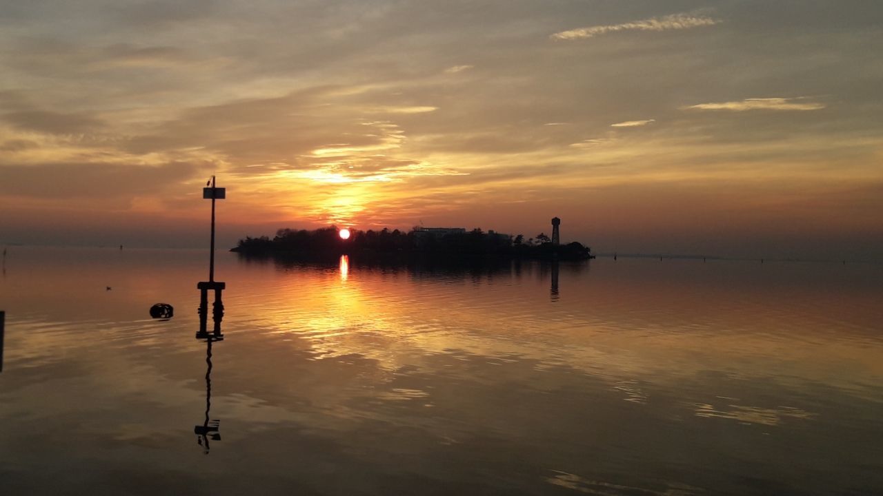 water, sky, sunset, reflection, beauty in nature, scenics - nature, cloud - sky, waterfront, orange color, tranquility, tranquil scene, nature, idyllic, silhouette, no people, sea, non-urban scene, outdoors, wooden post