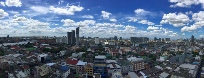 High angle view of modern buildings in city against sky