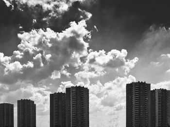 Skyscrapers in city against sky