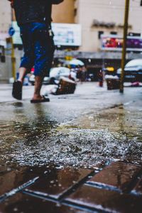 Low section of wet city street during rainy season