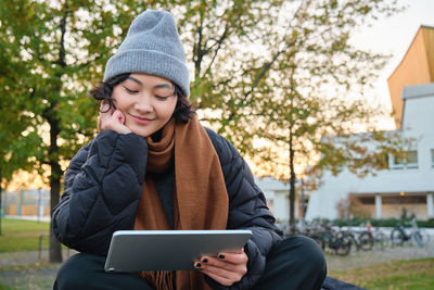 Young woman using digital tablet