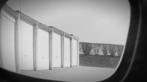 Built structure seen through glass window