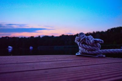 Close-up of wood against sky during sunset