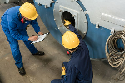 High angle view of people working in factory