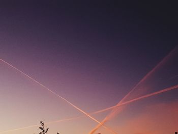 Low angle view of vapor trails in sky