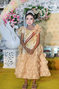 Portrait of girl wearing orange dress