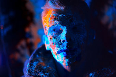 Close-up portrait of multi colored light painting