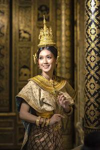 Smiling young woman at temple