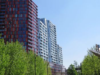 Low angle view of modern buildings against clear sky