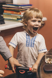 Portrait of boy playing with toy