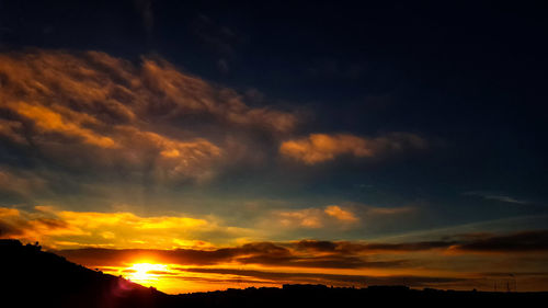 Low angle view of dramatic sky during sunset