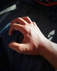 Close-up of man hand in car