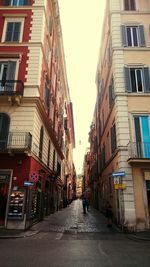 Alley amidst buildings in city
