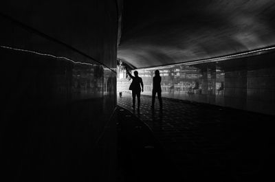 People walking in tunnel