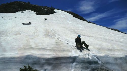 Full length of man sledding on snow covered mt lassen