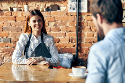 Young couple with text on table