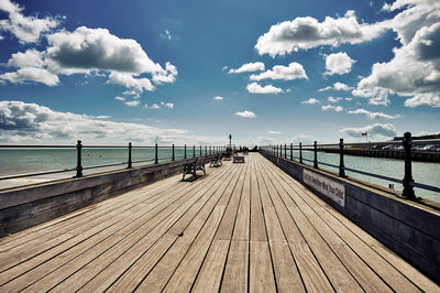 Pier over sea against sky