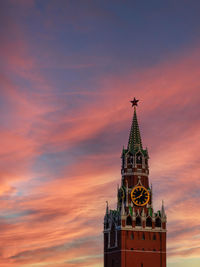 Low angle view of tower against sky during sunset