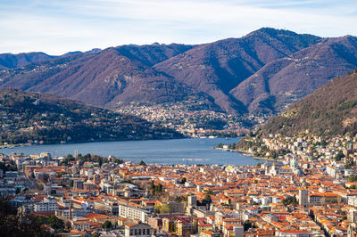 The city of como, the lake, the lakeside promenade, the buildings, photographed from above.