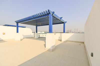 Built structure on beach against clear sky