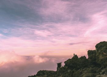 Low angle view of mountain against sky during sunset