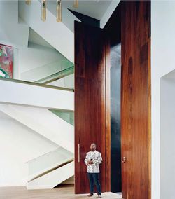 Rear view of man standing in building door 