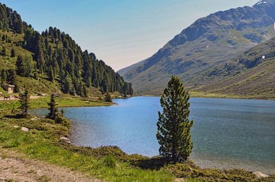 Scenic view of lake and mountains against sky