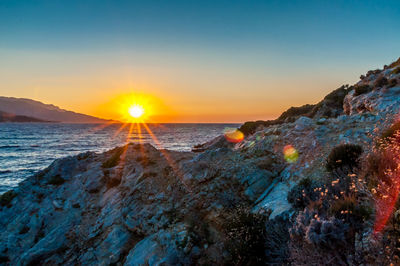 Scenic view of sea against sky during sunset