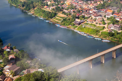 High angle view of river amidst buildings in city