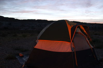 Tent on landscape against sky