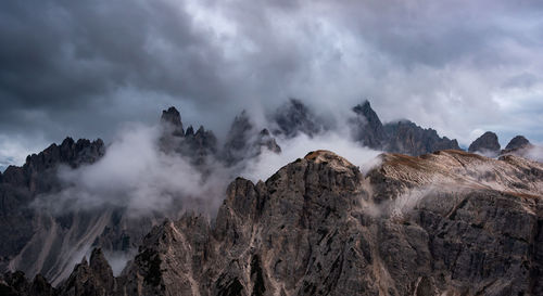 Mountain landscape with mist, at sunset. dolomites at tre cime di la vadero