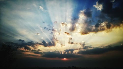 Low angle view of cloudy sky at sunset