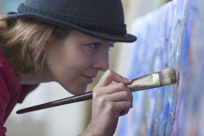 Close-up of woman painting